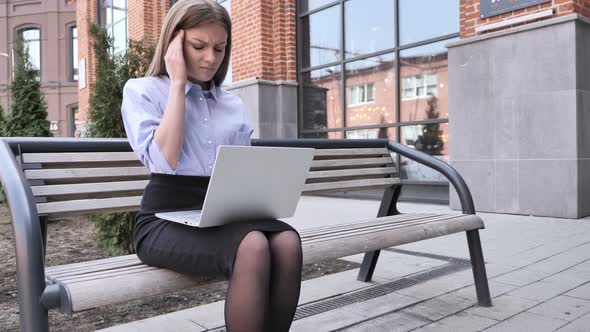 Headache, Tesne Woman Sitting Outside Office and Using Laptop