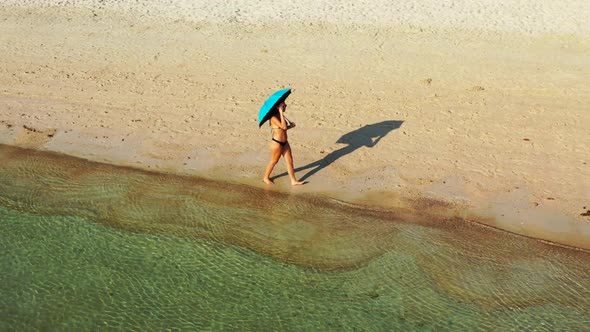 Ladies best friends on tranquil bay beach adventure by aqua blue ocean and bright sand background of