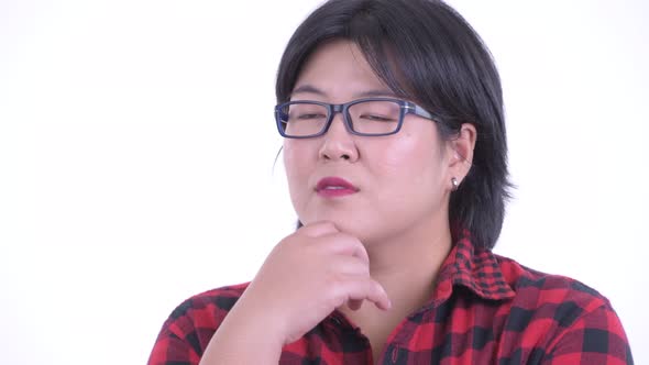 Face of Happy Overweight Asian Hipster Woman Thinking and Looking Up