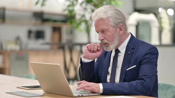 Senior Old Businessman Using Laptop