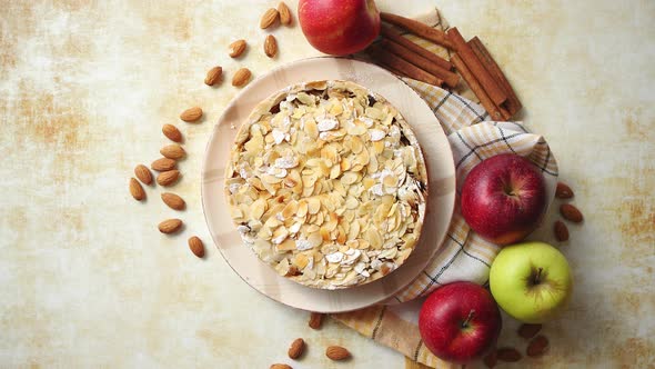 Freshly Baked Homemade Apple Pie with Almond Flakes Cake on Yellow
