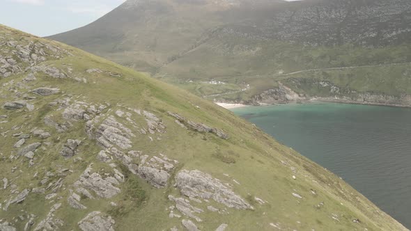 Drone Flying Over Foliage-covered Hill Revealing White Sand Keem Beach On The Atlantic Ocean Coast I