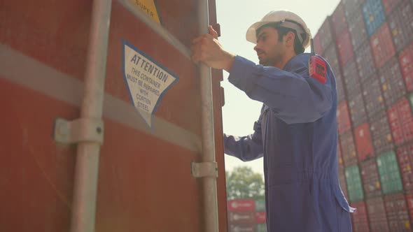 Caucasian senior worker docker hand open container cargo for checking