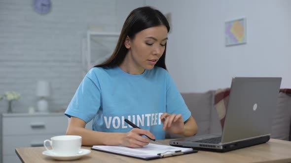 Social Worker Writing List Working Laptop and Smiling on Camera, Charity Fund