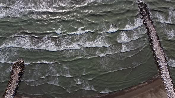 Muddy Sea Water on a Sandy Beach