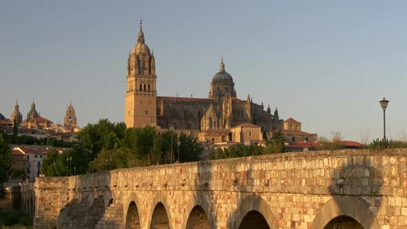Salamanca Cathedral and Old Bridge at Sunset. Castile and Leon, Spain. Panning Shot