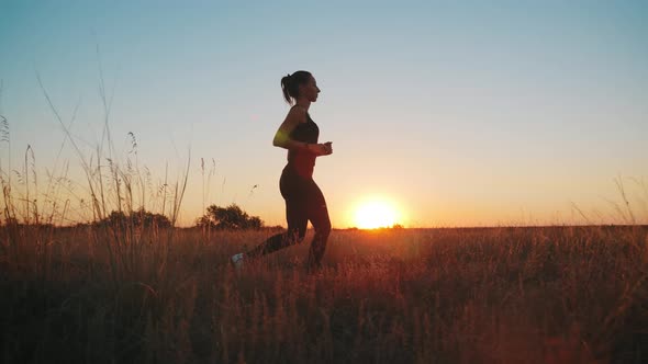 Young Fitness Sport Woman Running on Road at Sunset. Athlete Runner Feet Running on Road, Slow
