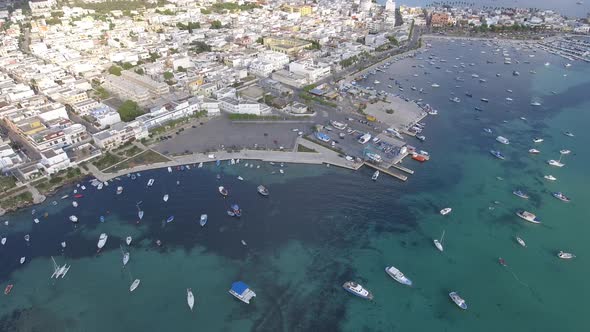 Beautiful tourist port aerial view with emerald water in southern Italy