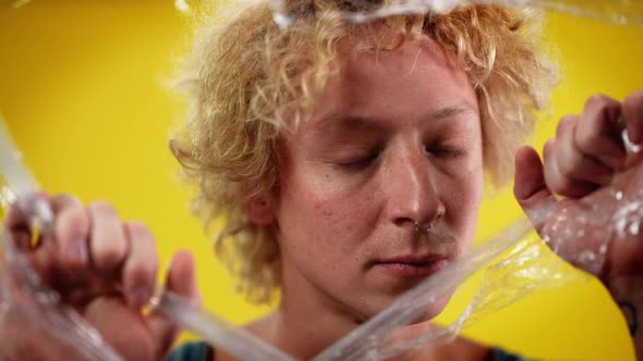 Closeup Male Queer Person Biting Food Film Looking at Camera