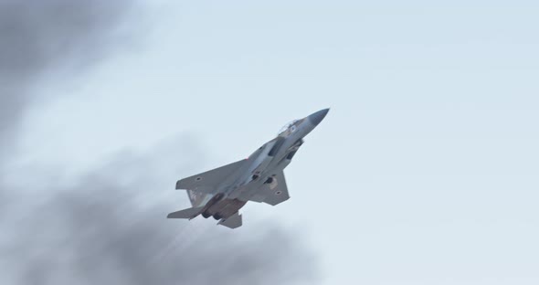 F-15 fighter jet maneuvering during an airshow