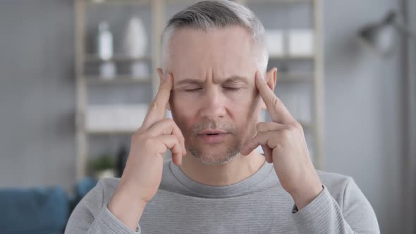 Headache Portrait of Tense Middle Aged Gray Hair Man