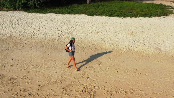 Girls enjoying life on exotic seashore beach journey by blue water with white sandy background of Ko