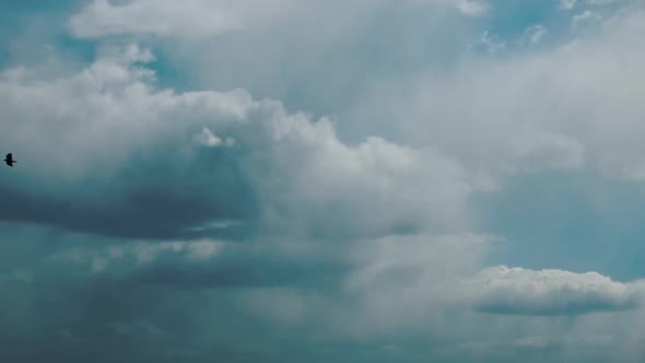 Sun Rays Shining Through Cloudy Rainy Sky With Fluffy Rain Clouds. Sky Natural Background. Weather