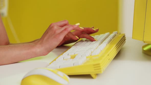 Woman Is Typing On Yellow Keyboard