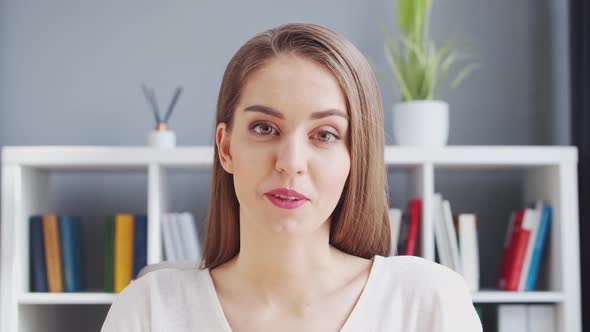 Young Woman Works at Home Office Using Computer.