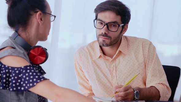 Creative Business People Group Having Conversation at Office Desk in Workplace