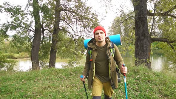 Man with Hiking Equipment Walking in the Place with Amazing Landscape.