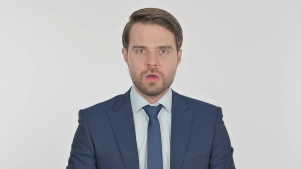 Surprised Young Businessman Feeling Amazed on White Background