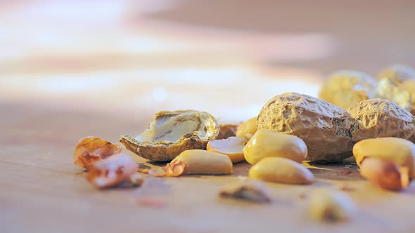 Detail Of Shell Peanuts And Out With Pieces Of Shell Falling From Above