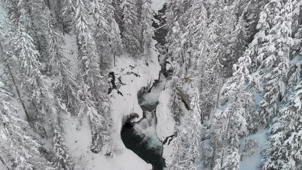 looking down flying up from winter waterfall