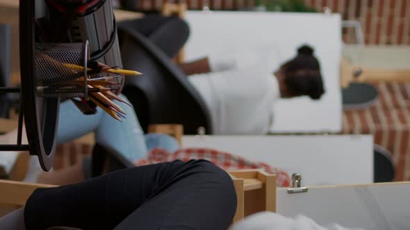 Vertical Video Student Using Colorful Pencils on Table to Draw Sketch in Art Class