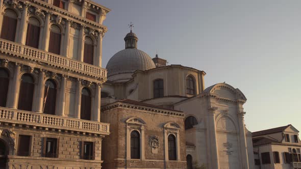 Wide shot of Catolic Church Chiesa di San Geremia in golden morning light, Venice, Italy