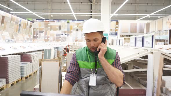 Confident Male Talking on Telephone on Duty.