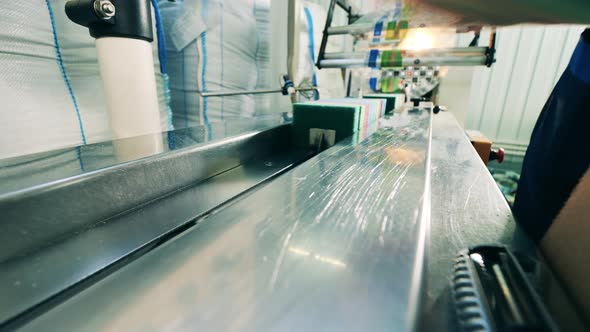 Batches of Kitchen Sponges Are Getting Put Onto the Conveyor