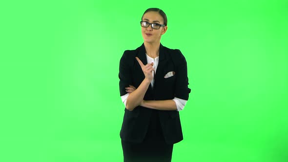 Girl Listens Carefully, Threatens with a Finger and Waves Her Head Negatively, Green Screen