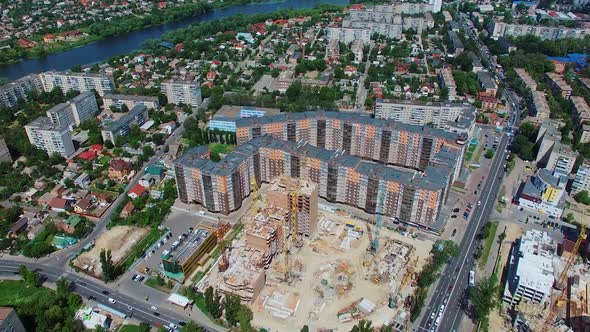 Construction site of a modern district in the city. Urban background with beautiful high-rise buildi