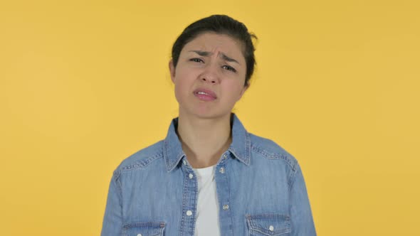 Indian Woman Having Loss, Yellow Background 