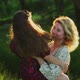 Young Woman and Child Hugging in Field - VideoHive Item for Sale