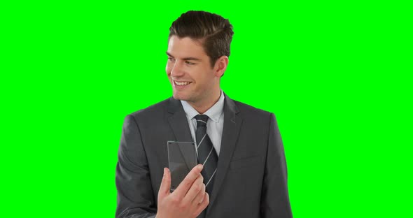 Businessman pretending to use mobile phone