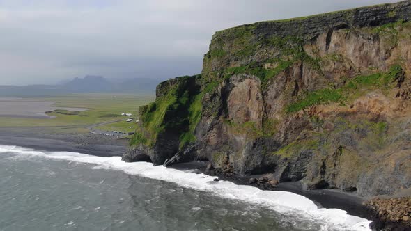 Reynisfjall tuff mountain at Reynisfjara black sand beach in Iceland