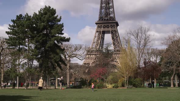 Eiffel Tower with trees in the foreground.