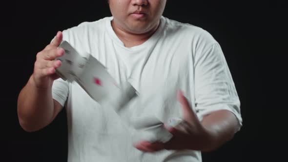 Man Showing Card Spring, Cardistry On Black Background