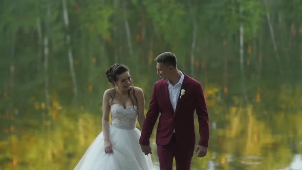 Newlyweds Go Against the Water and Smile