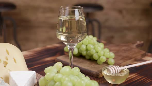 Wine and Appetizer Concept on a Wooden Background