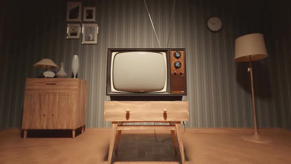 Old-fashioned vintage tv with antenna on the tv stand in the retro apartment.