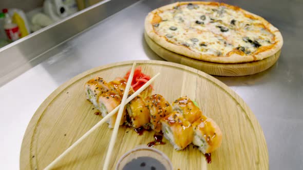 Pizza and Sushi on Wooden Trays