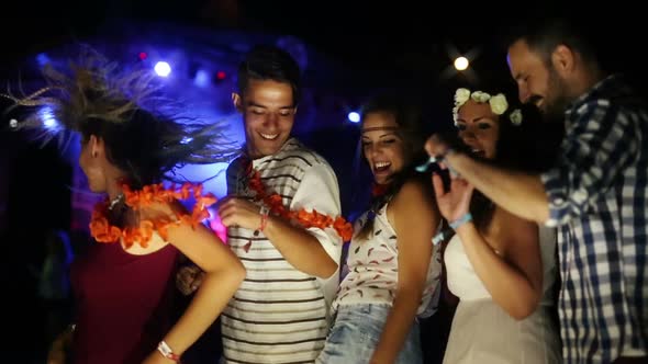 Group of Friends Having Fun and Dancing at Concert