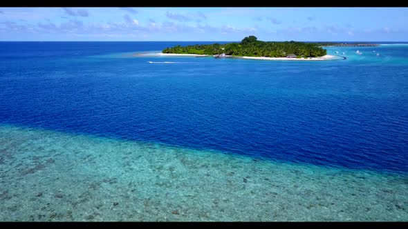 Aerial top view travel of relaxing sea view beach holiday by transparent lagoon with white sand back