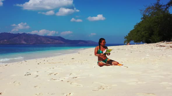 Girls best friends on paradise shore beach break by blue lagoon and white sand background of Lombok 