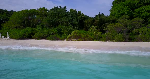 Wide birds eye island view of a white sand paradise beach and blue water background in best quality 