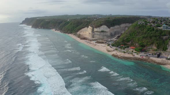 Aerial Footage Tropical Beach and Blue Sea Water with White Waves Drone View