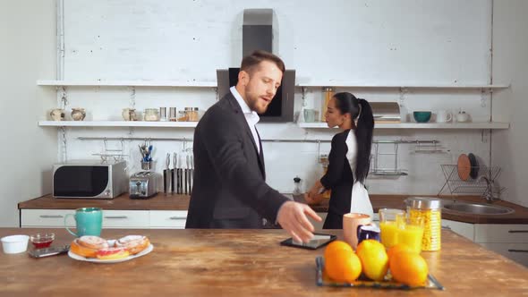 Beautiful Caucasian Couple Wear Business Looks at Their Home Before Work