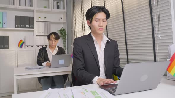 Asian handsome businessman gay people working in office with happiness.