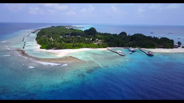 Aerial top view travel of perfect coastline beach voyage by aqua blue sea with white sandy backgroun