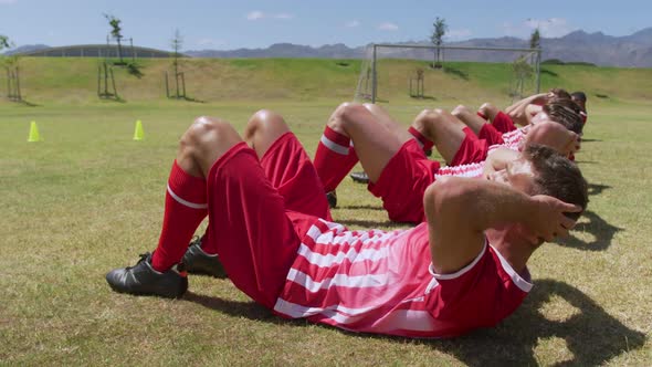 Soccer players working out on field