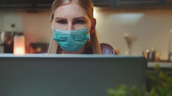 Close-up of Business Woman Working at the Computer and Shifting Medical Mask From Face Todrink